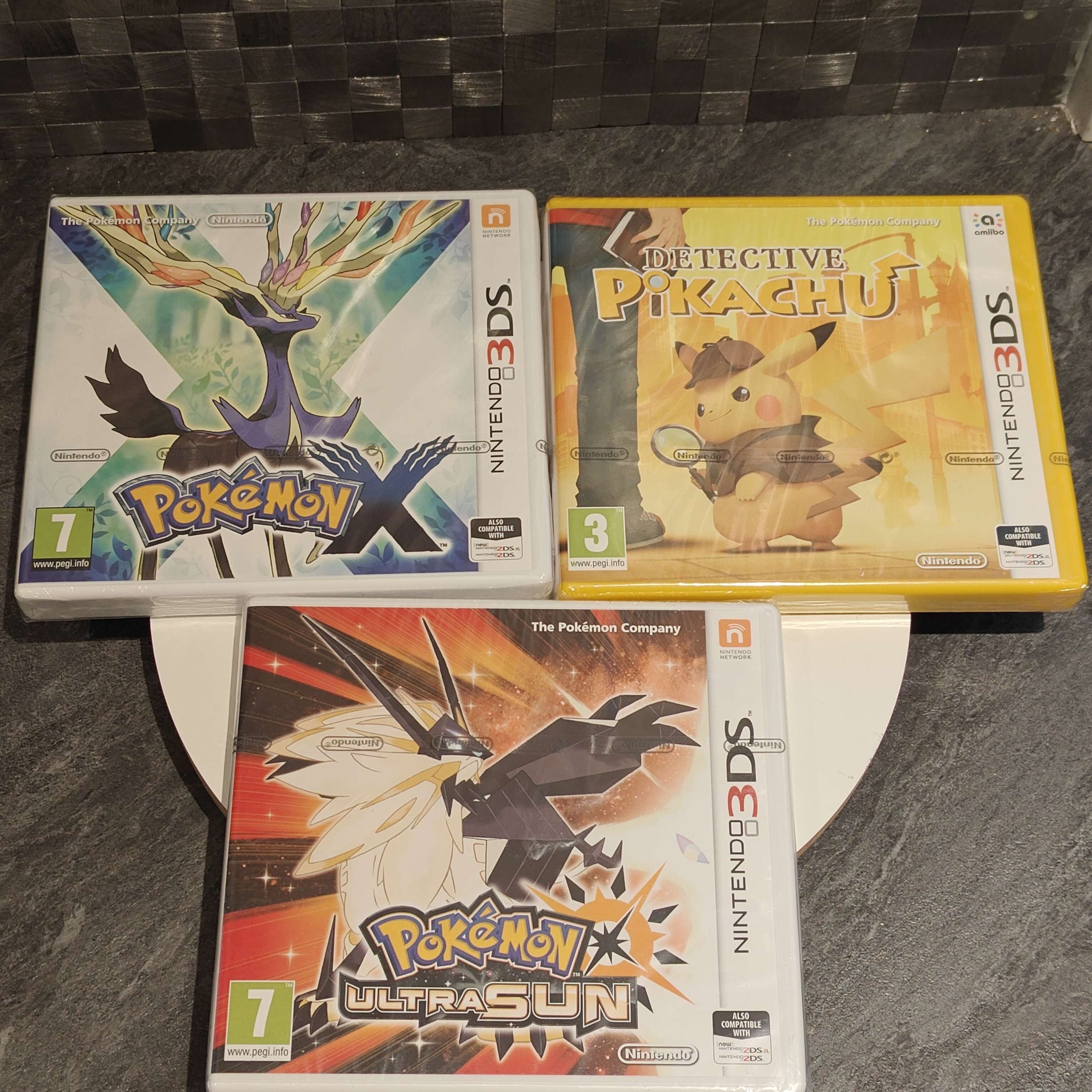 Three factory-sealed Pokémon games from a marketplace listing